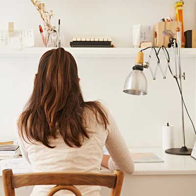 student studying at desk in bedroom