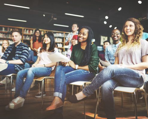 students in a fun class in the library over summer break