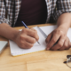 high school student working on outline for college essay
